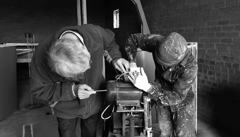 Technician repairing a generator motor